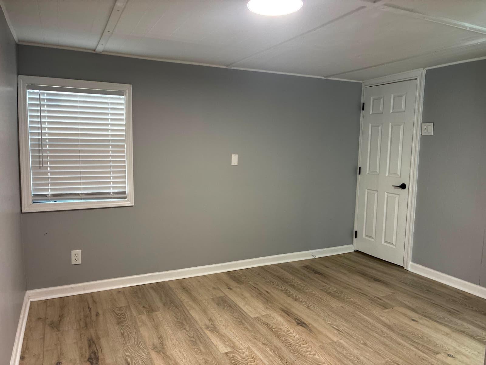Bedroom with wood flooring and window blinds at 151 Fleetwood Dr