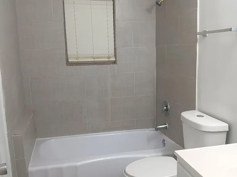 Tiled bathroom with tub at 1443 Wrenwood St