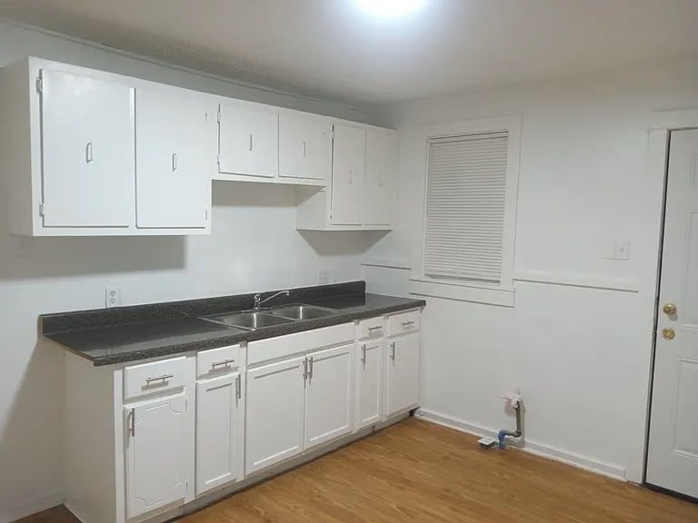 Kitchen with white cabinets at 1443 Wrenwood St