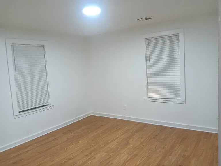 Bright bedroom with wood flooring at 1443 Wrenwood St