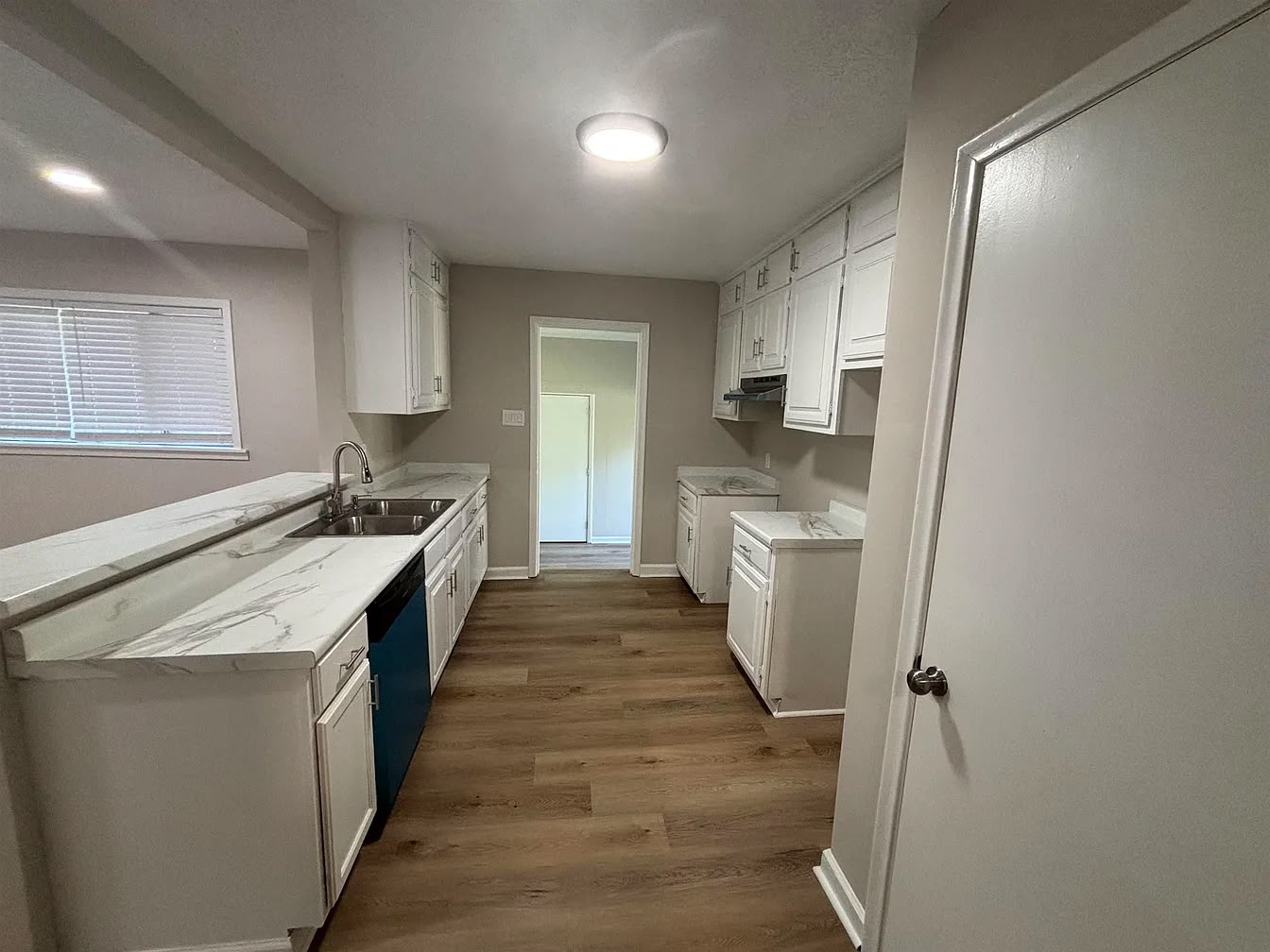 Galley kitchen with white cabinets at 2805 W Lake Shore Dr