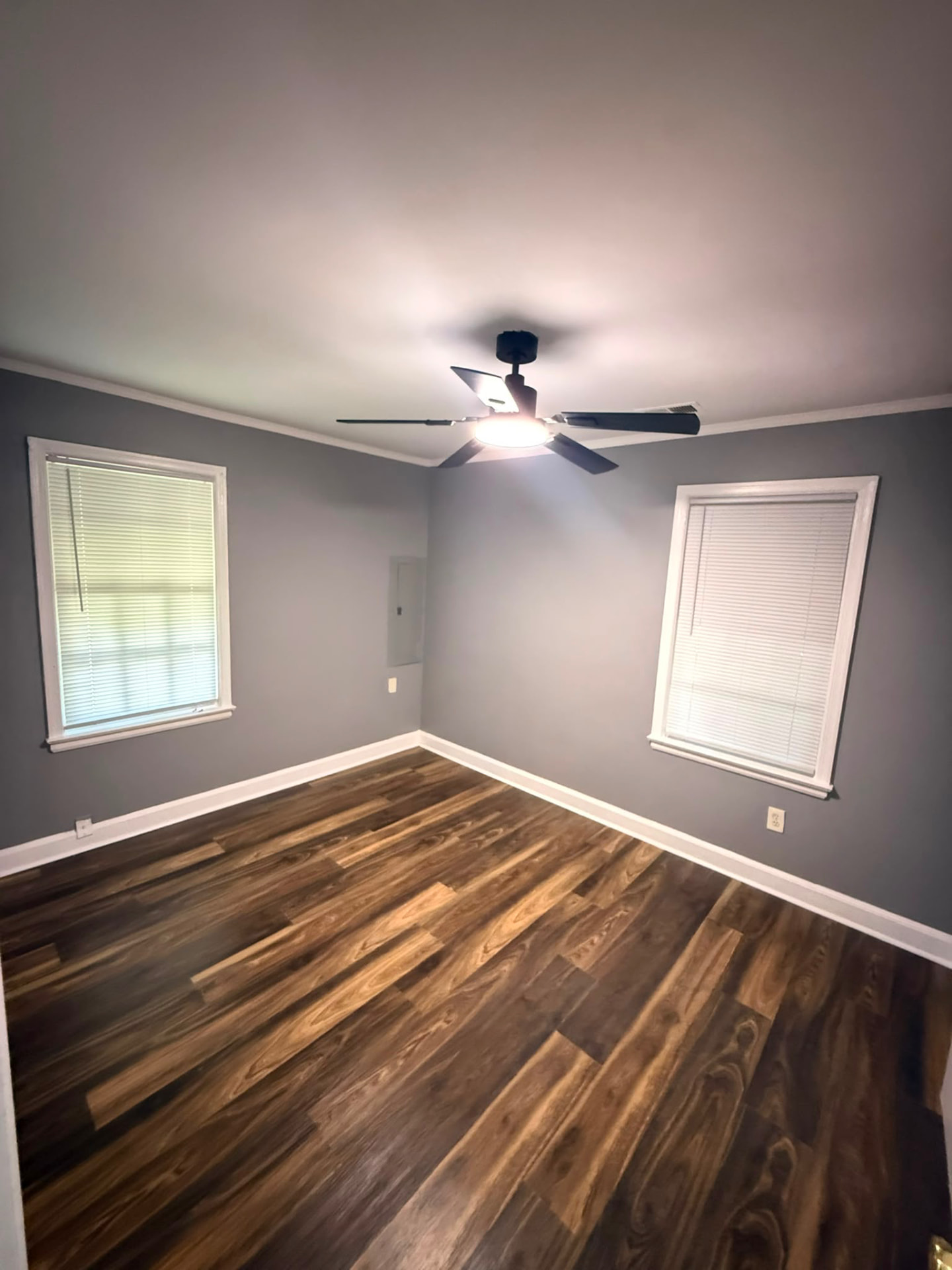 Bedroom with ceiling fan and wood flooring at 962 Inman Rd