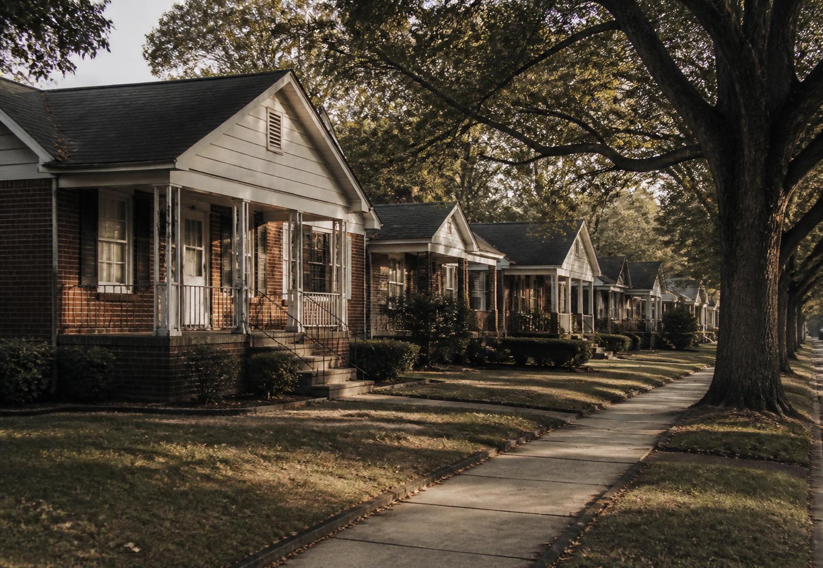 A tree-lined street of brick homes in Memphis